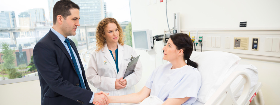 Dr. Mayo and registered nurse Rachel Shafer together greet a patient at the South Waterfront clinic.