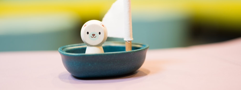 A smiling wooden toy bear sits inside a toy sailboat at OHSU Doernbecher Children’s Hospital.