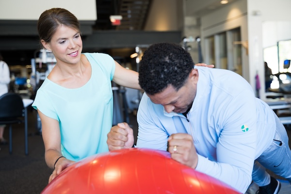 Physical therapists work with patients in well-equipped facilities.