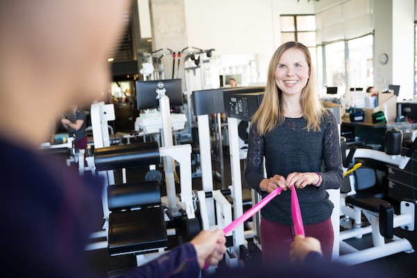 Physical therapists work with patients in well-equipped facilities.